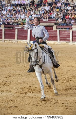 Ubeda SPAIN- October 2 2010: Spanish bullfighter on horseback Leonardo Hernandez bullfighting a gesture of satisfaction and triumph in the bullring of Ubeda Spain