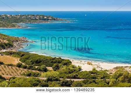 Holidaymakers And Turquoise Mediterranean At Bodri Beach In Corsica