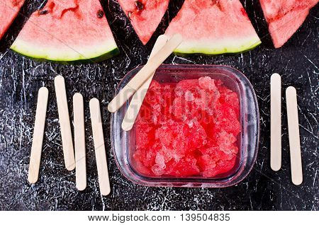 Homemade sorbet of watermelon on a dark background. Selective focus.