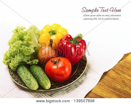 Plate with vegetables on a wood and white background