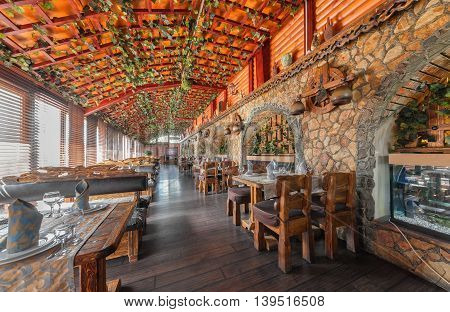 MOSCOW - JULY 2014: The interior of the enclosed porch of the restaurant "VODOPAD"