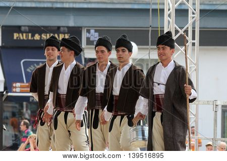 ZAGREB, CROATIA - JULY 22: Members of folk group Etnos from Skopje, Macedonia during the 50th International Folklore Festival in center of Zagreb, Croatia on July 22, 2016