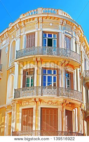 Balcony on the corner of building in Athens, Greece