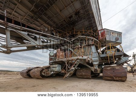 Cab and career excavator. Many buckets of giant quarry excavator Equipment for the extraction of sand from the quarry.
