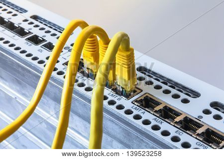 Radio base station and yellow patch cords. Internet. Communication. Network