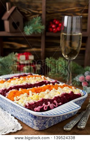 Traditional Russian salad "Herring under a fur coat". Layered salad with herring and vegetables