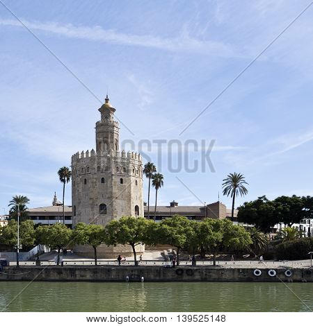 SEVILLE, SPAIN - September 13, 2015: The Torre del Oro (Tower of the Gold) a dodecagonal military watchtower seen from the Guadalquivir River on September 13, 2015 in Seville, Spain