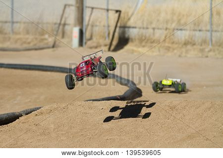 BOISE IDAHO-JULY 16 2016: truggy taking off the ram being chased by another racer at the Boise Summer Blast points race
