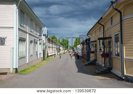 NAANTALI, FINLAND - JUNE 13, 2015: Old street of Naantali town under stormy skies. Historical landmark of the city Naantali, Finland
