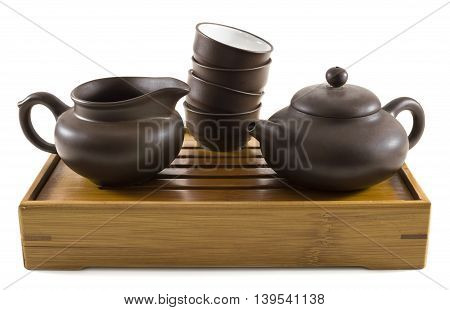 Set of dishes for chinese tea ceremony on tray, isolated on white