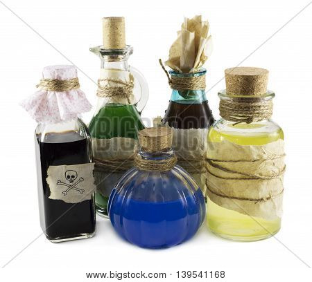 Glass bottles with magic remedies isolated on white