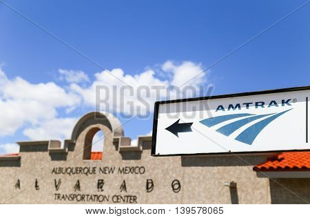 ALBUQUERQUE, USA - MAY 24, 2015: Facade of the Alvarado Transportation Center with an Amtrak sign in the foreground.