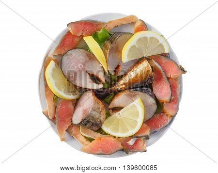 Plate of cold-smoked salmon and mackerel with lemon and lettuce