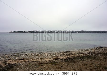 A view of Little Traverse Bay and the Harbor Point Peninsula, as seen from the beach in Wequetonsing, Michigan