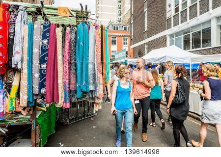 London United Kingdom - July 22 2016: Leather Lane Street Market - street in Holborn with great streetfood fruit and vegetables and clothes stalls very popular with office workers Monday to Friday