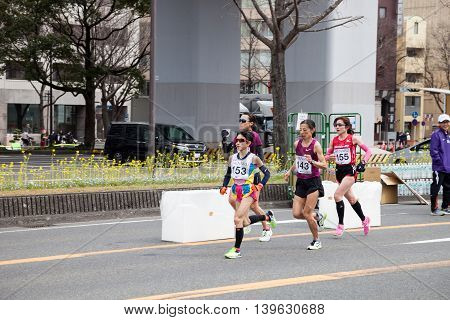 NAGOYA JAPAN - MARCH 13, 2016: Nagoya Women's Marathon 2016. Women's running in the downtown. Course Start and finish at Nagoya Dome Distance 42.195km. Nagoya city Japan.