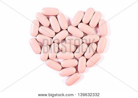 Heart Shaped Medical Pills And Capsules On White Background, Health Care Concept