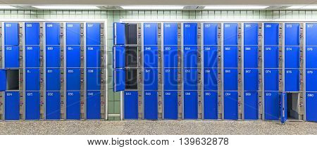 row of lockers at with blue doors at the railway station