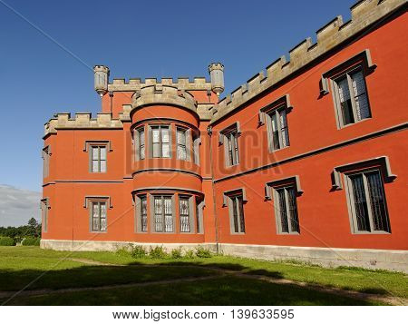 Romantic castle with red facade. Hradek u Nechanic. Czech Republic. Nechanice. July 7, 2016
