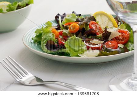 Fresh vegetable salad on a white table