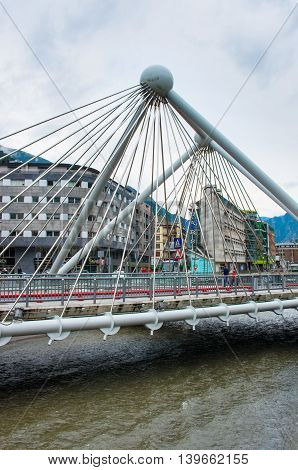 ANDORRA LA VELLA ANDORRA - JULY 28: Bridge through Gran Valira river in Andorra la Vella on July 28 2014 Andorra.