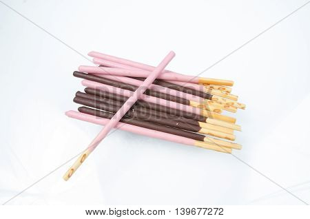 Japanese snack food biscuit stick strawburry coated on white background