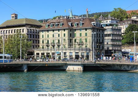Zurich, Switzerland - 20 July, 2016: view on Bahnhofbruecke bridge and Central square across the Limmat river. Zurich is the largest city in Switzerland and the capital of the Swiss canton of Zurich.