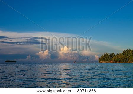 Panoramic View Bungalow in Indonesia Village Tropical Beach in Bali Island Sunrise. Summer Season Caribbean ocean. Horizontal Picture