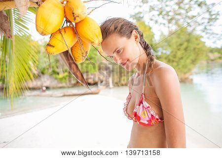 Smiling Woman Spending Chill Time Outdoor Bali Tropical Island. Exotics Summer Season Caribbean Ocean. Exotic Fruits Palm. Horizontal Picture. Blurred background