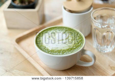 Hot Green Tea Set On A Wooden Table In A Coffeshop