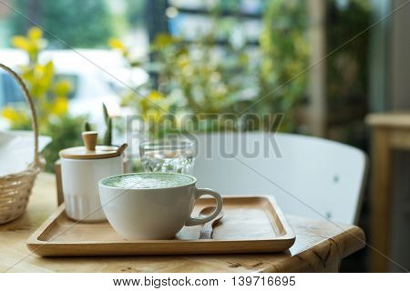 Hot Green Tea Set On A Wooden Table In A Coffeshop