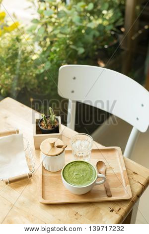 Hot Green Tea Set On A Wooden Table In A Coffeshop