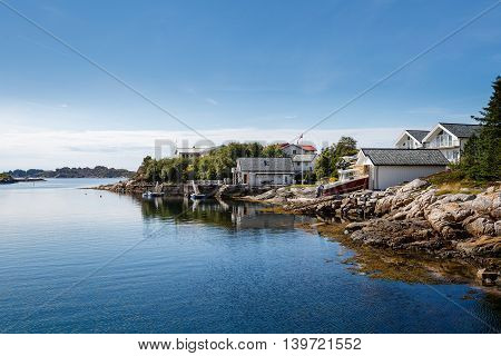 Beautiful view on nowegian fjords and seaside houses. Tranquil scene.