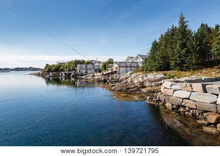 Beautiful view on nowegian fjords and seaside houses. Tranquil scene.