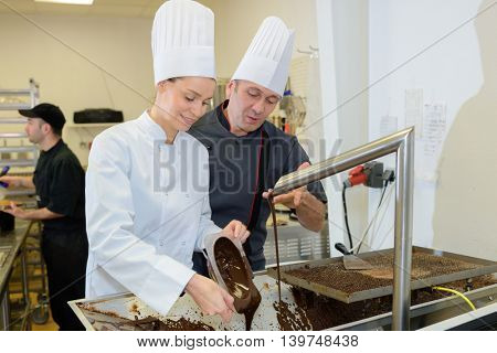 commis chef and cook chef at the indoor restaurant service