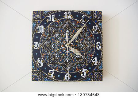 blue square hand-painted watch with contour acrylic paints in the technique point to point, with a geometric pattern in the form of a mandala, white numerals and silver arrows