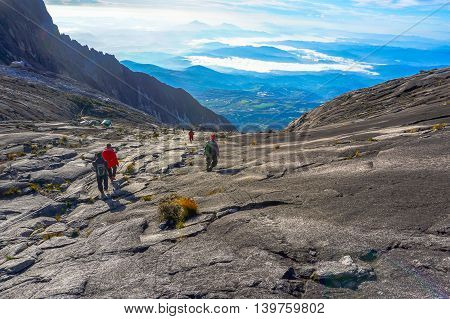 Ranau,Sabah,Borneo-March 13,2015:Group of climbers move down from Low's Peak to Sayat-Sayat check point at Mountain Kinabalu.Sabah