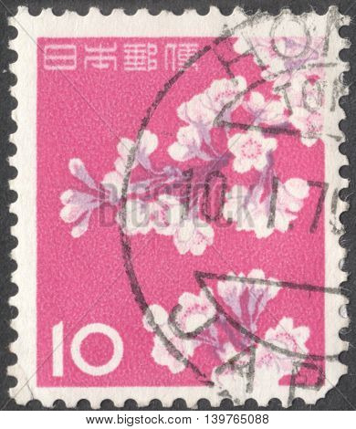 MOSCOW RUSSIA - CIRCA JANUARY 2016: a post stamp printed in JAPAN shows a sakura branch circa 1962