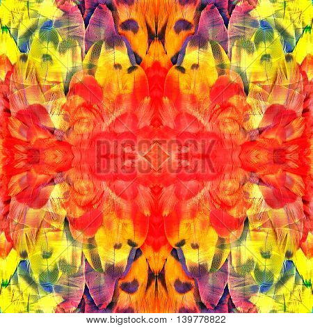 Seamless red and yellow in fire look background made of Scarlet Macaw parrot bird feathers exotic texture