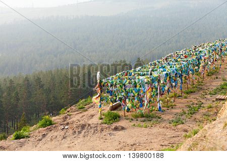 Prayer flags and Hadak at sunset in the Republic of Buryatia. Datsan Rinpoche Bagsha on Bald Mountain in Ulan-Ude, Russia.