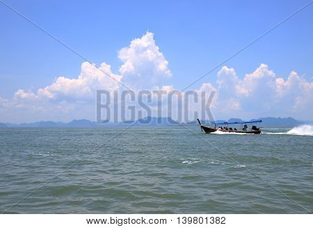 longtail boat runing on Phang Nga Bay go to Koh Panyee island