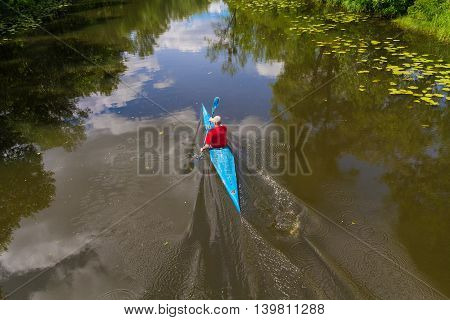 Man on the river training in kayaking. Sport
