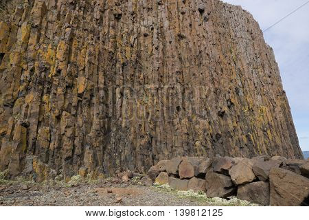 Basalt columnar rock formation wall at beach, Stykkisholmur, Iceland
