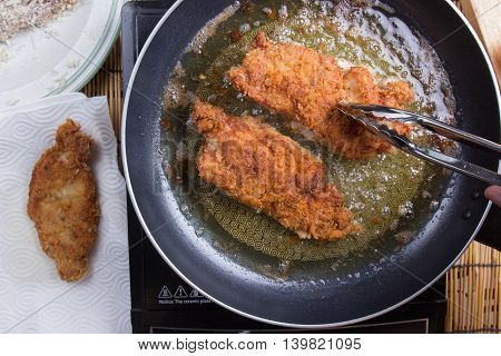 Chef deep fried pork in pan / cooking Japanese pork curry paste concept