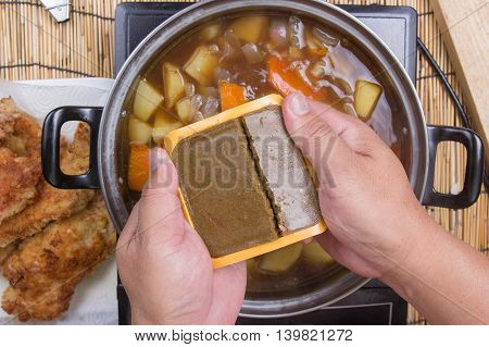 Chef prepared putting curry pasted for cooking / cooking Japanese pork curry paste concept