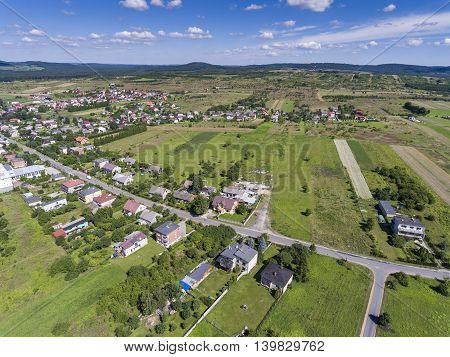 Rural Landscape With Green Hill And Blue Sky In Poland. View From Above.