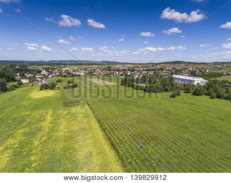 Rural Landscape With Green Hill And Blue Sky In Poland. View From Above.