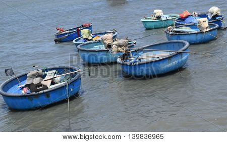 traditional basket boat and ship in the bay of fishing village muine vietnam
