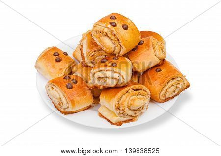 Home baking with nuts chocolate raisins on the plate on a white background.