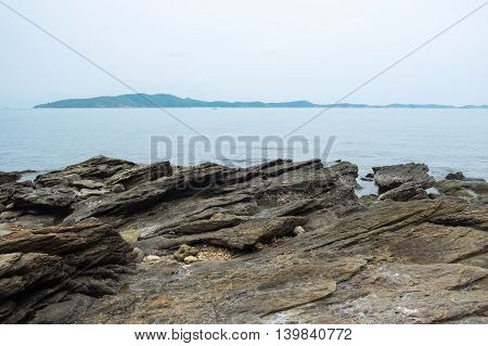 Rock on sea coastline with seascape view at Mu Ko Samet National Park in the Gulf of Thailand.